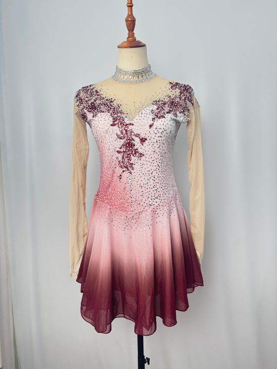 Pink ombre competition skating dress with burgundy crystal lace — the product photo customers pick in the studio